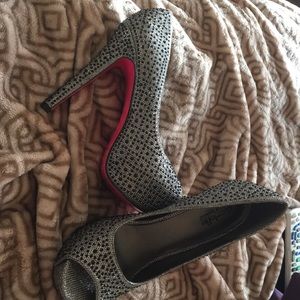 Black studded pink bottom heels